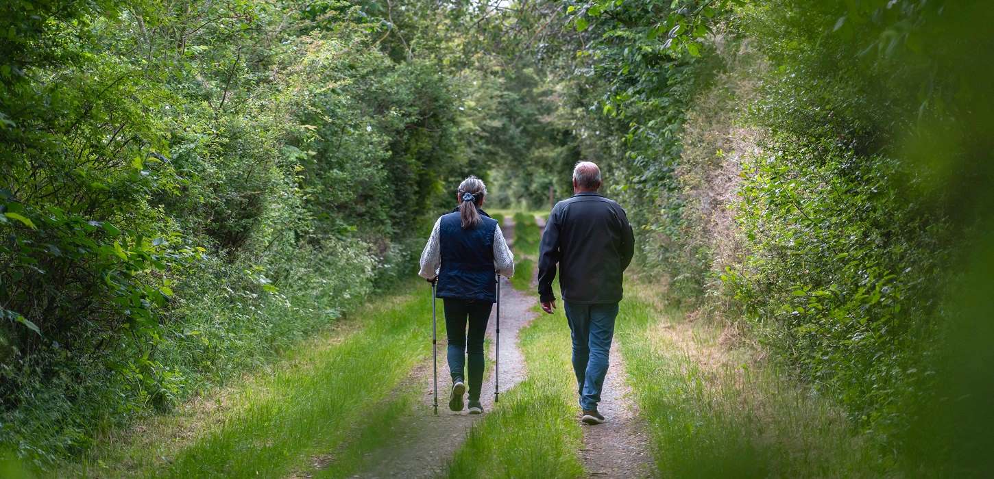A couple walks on the Red Clover Path in Nyborg